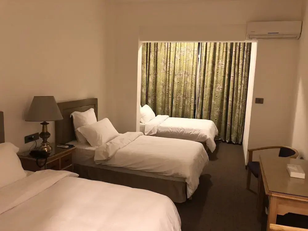 Deluxe Triple room with courtyard view