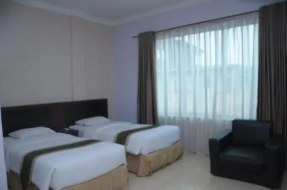 Griya Hotel - Chambres