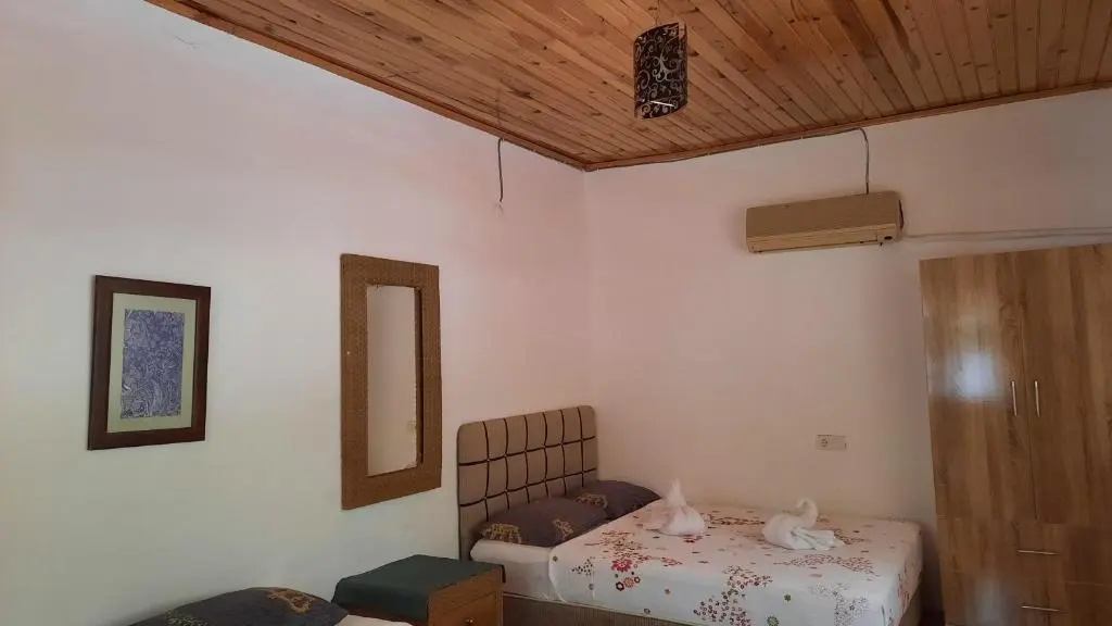 Standard Triple room with garden view
