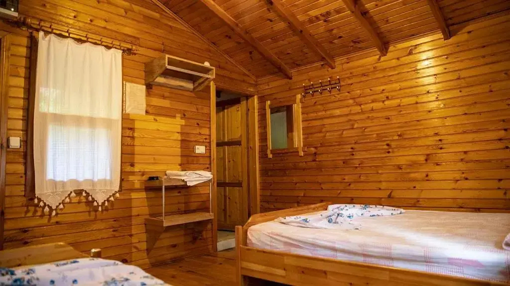 Standard Triple room with garden view