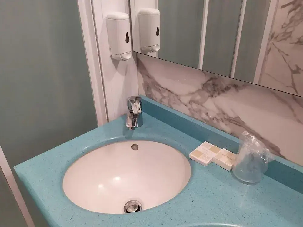 Standard Quadruple room with partial sea view