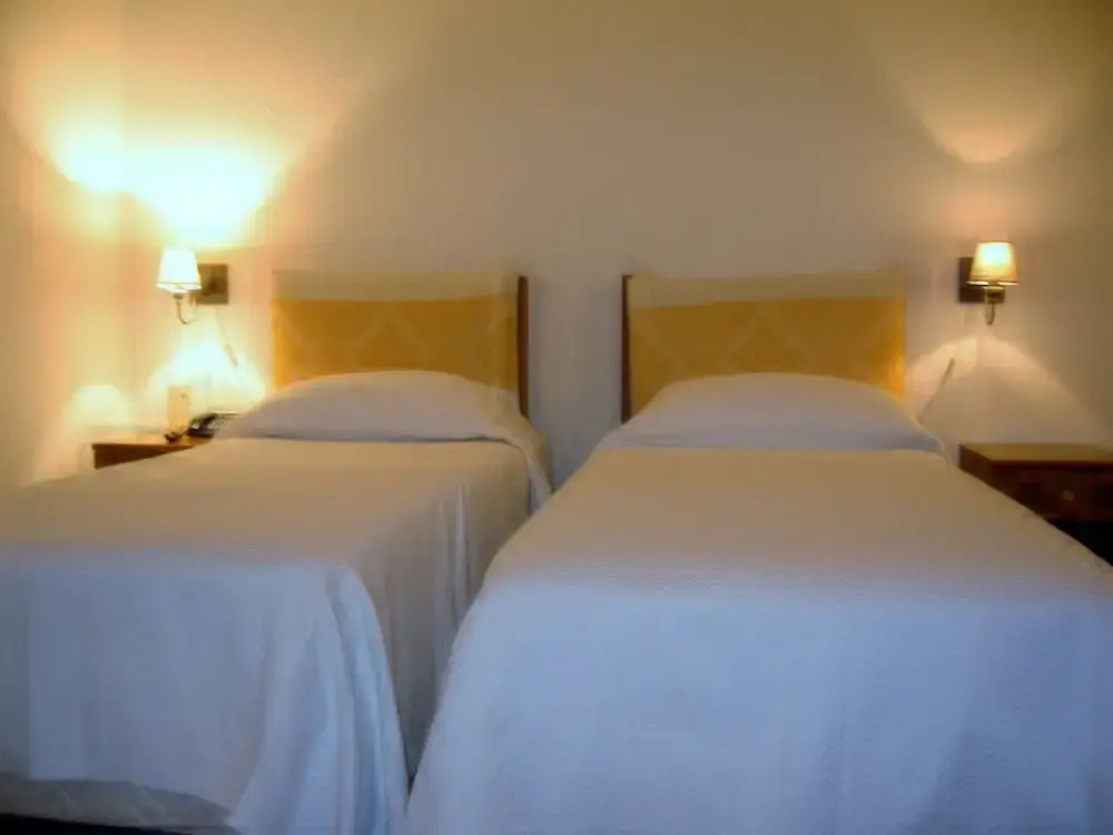 Standard Triple room with balcony and with garden view