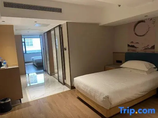 Xinyue Hotel - Chambres