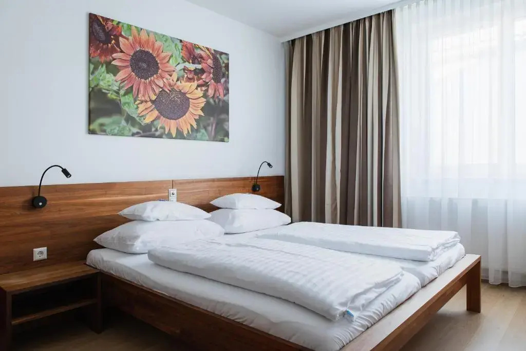H+ Hotel Ried - Chambres