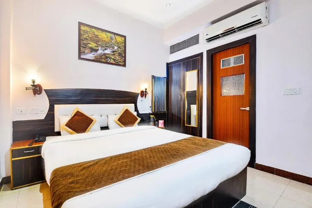 OYO 5539 Merit Hotel - Chambres