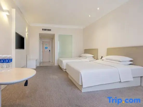 Tian Long Hotel - Chambres