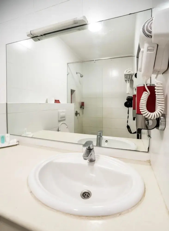 PrideInn Hotel Raphta - Chambres