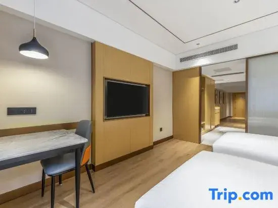 Xinyue Hotel - Chambres