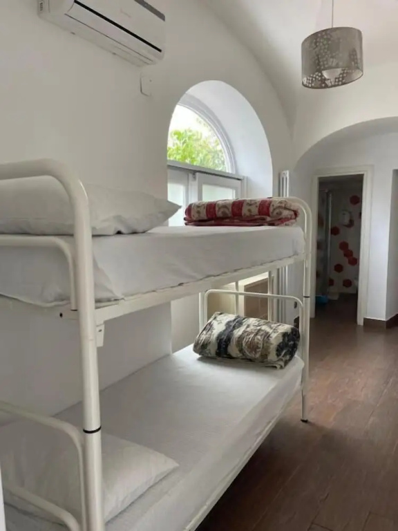 Bed in Dorm with courtyard view