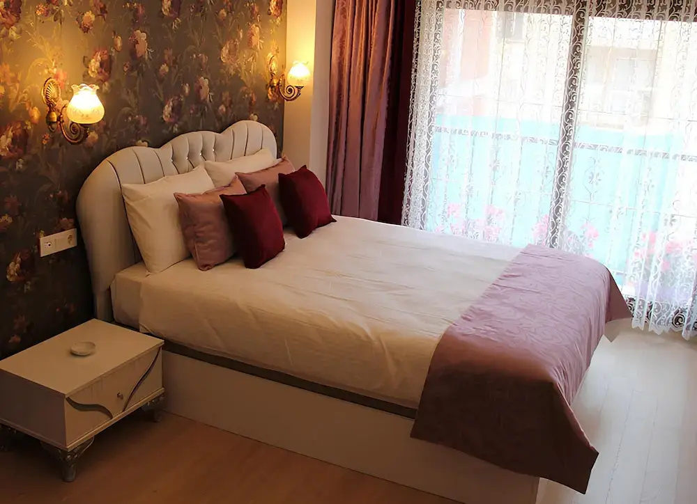 Deluxe Quadruple room with balcony