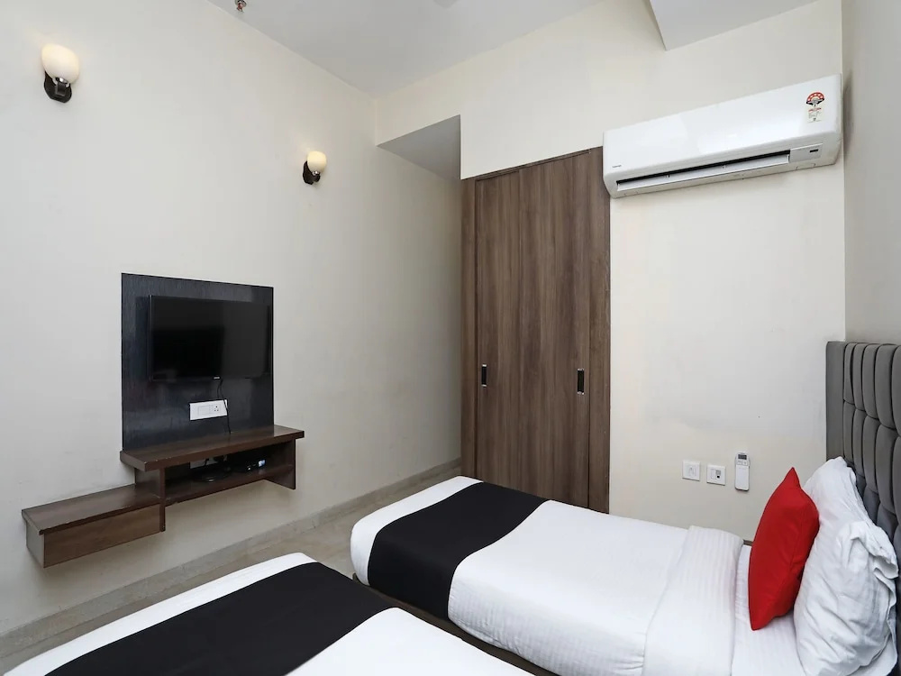 Capital O 3831 Jade Inn - Chambres