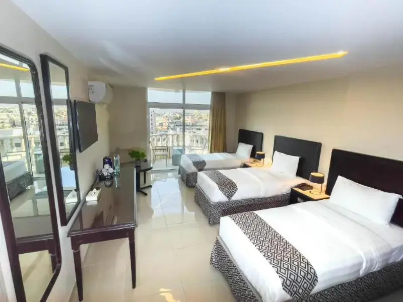 Deluxe Quadruple room with balcony