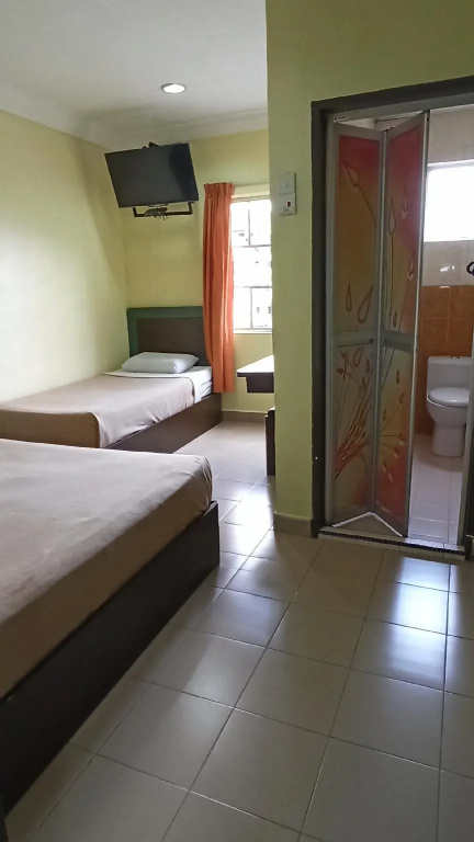 Ria Cameron Hotel - Chambres