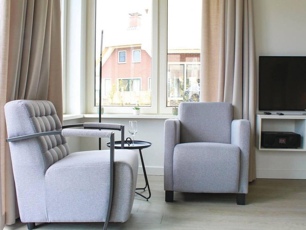 Wellness villa with sauna, at a holiday park on the water in Friesland