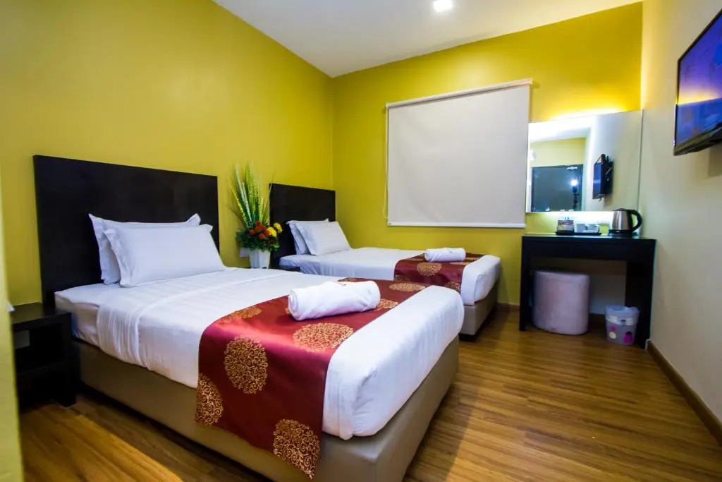 Capital O 91074 Grand World Hotel - Chambres