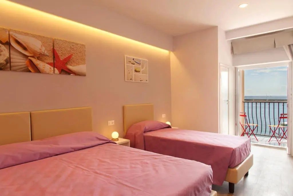 Standard Quadruple room with balcony and with sea view