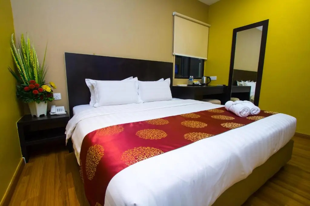 Capital O 91074 Grand World Hotel - Chambres