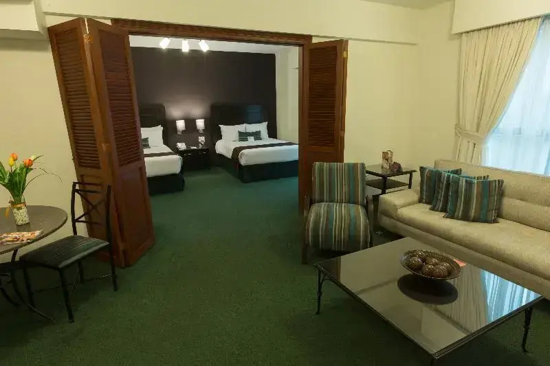 El Polo Hotel & Suites - Chambres