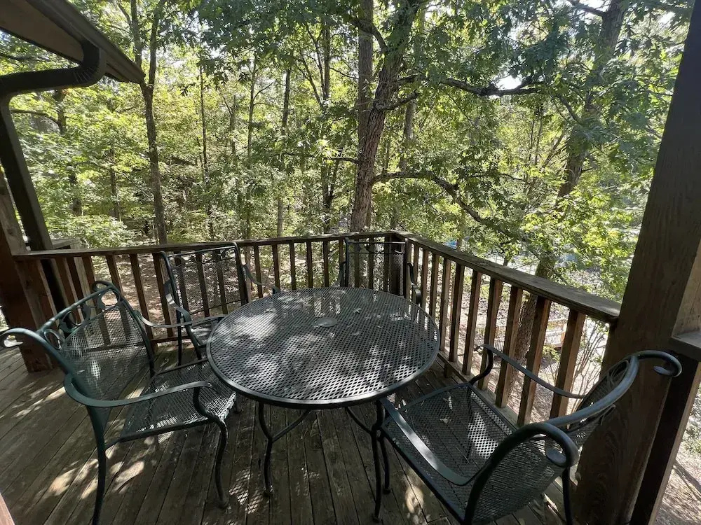 Forest view, log-sided two bedroom, two bath condo on Lake Ouachita. by RedAwning