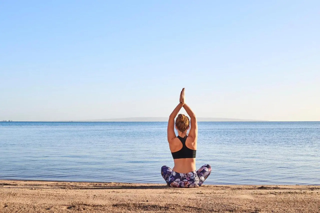 Steigenberger Pure Lifestyle (Adults Only): A quiet beach yoga moment with open sea views.