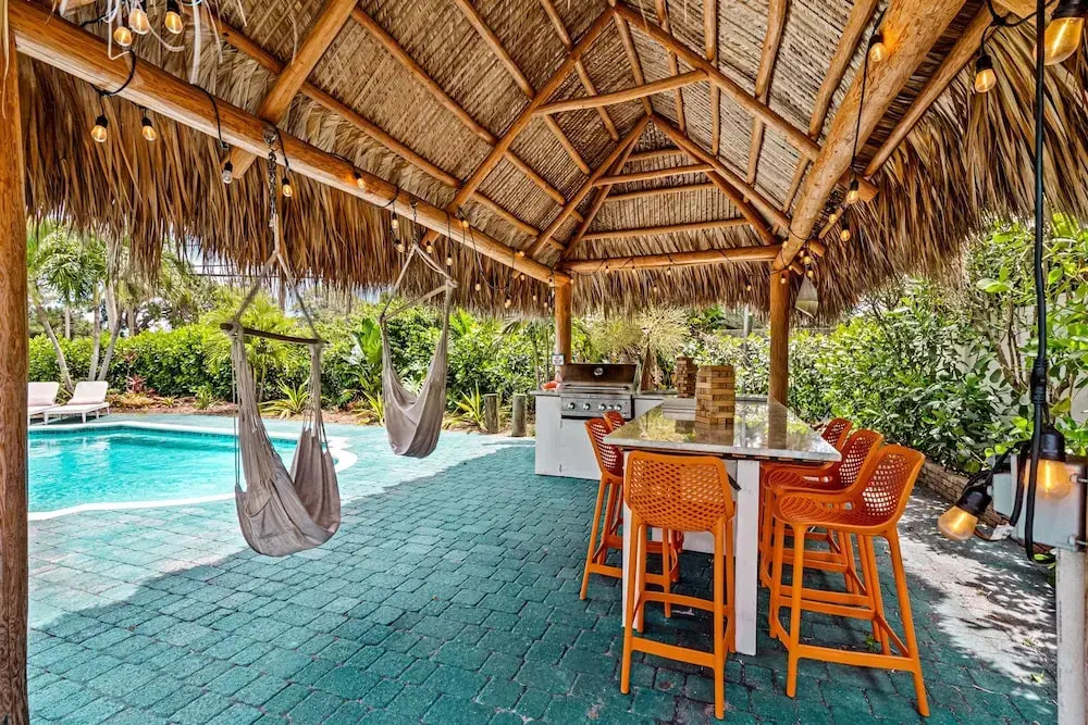 Eccentric Home With Pool Tiki hut Outdoor Kitchen