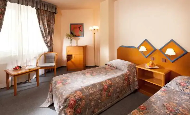 Hotel Concertino Zlatá Husa - Chambres