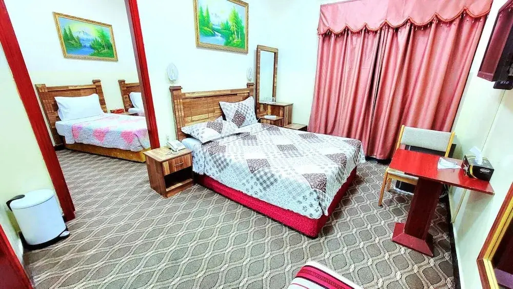 Deluxe Quadruple room with balcony