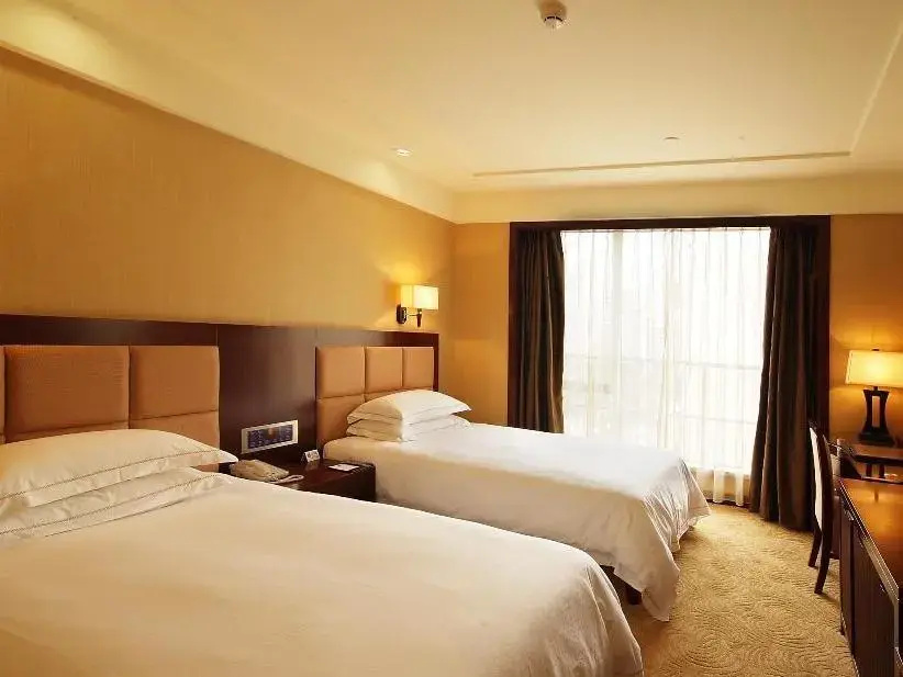 Dong Cheng Hotel - Chambres