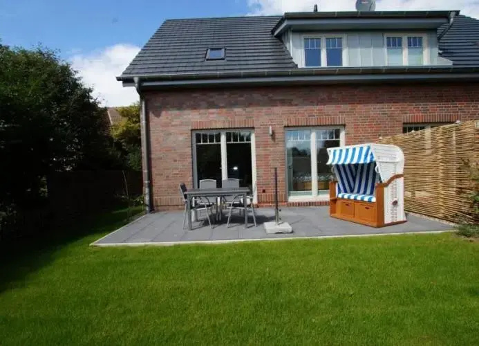 Inselparadies - Neubauwohnung mit großer Terrasse, Strandkorb und Garten.