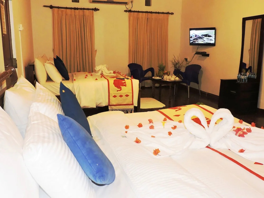 Standard Quadruple room with garden view