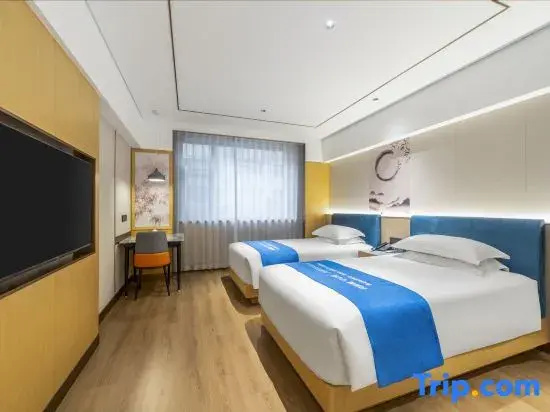 Xinyue Hotel - Chambres