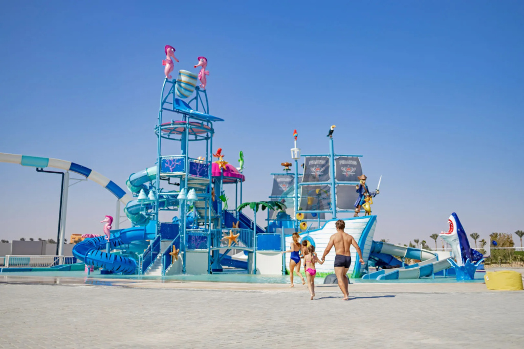 Mövenpick Waterpark Resort & Spa Soma Bay: A colorful outdoor water park features twisting slides and a large themed water-play structure.