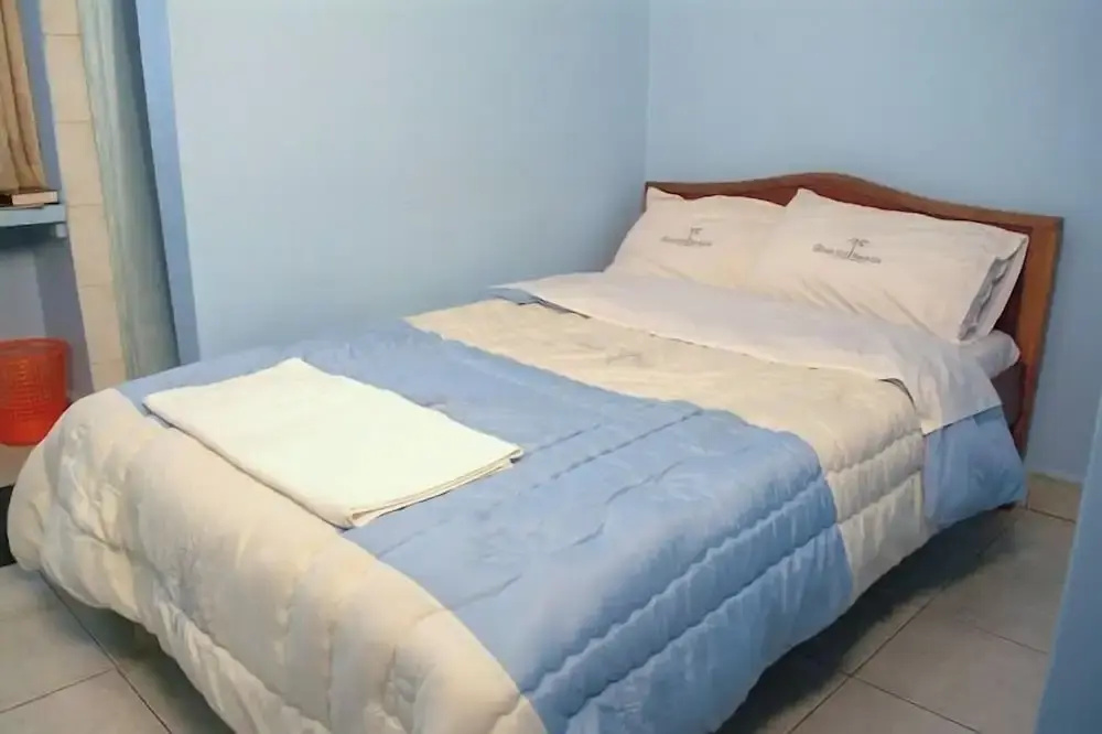 The Coconut Grill Hotel - Chambres