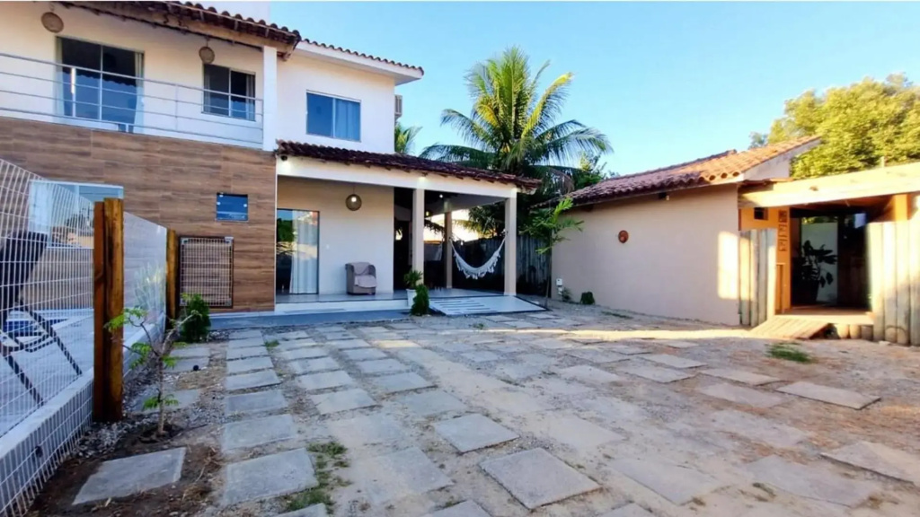 Casa de 4 suítes com piscina e área gourmet em Porto Seguro - Casa dos Ipês