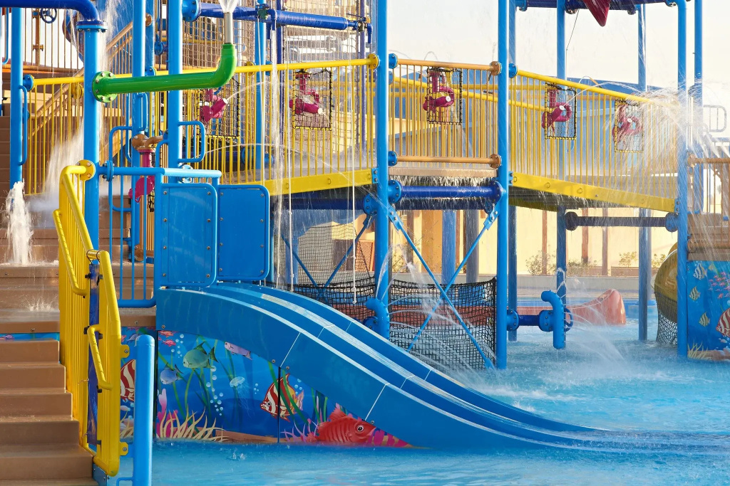 Sheraton Soma Bay Resort: A colorful children’s water-play area with a slide, splash features, and a pool.