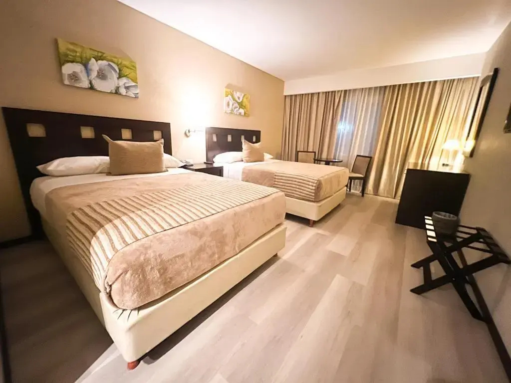 Howard Johnson by Wyndham Funes - Chambres