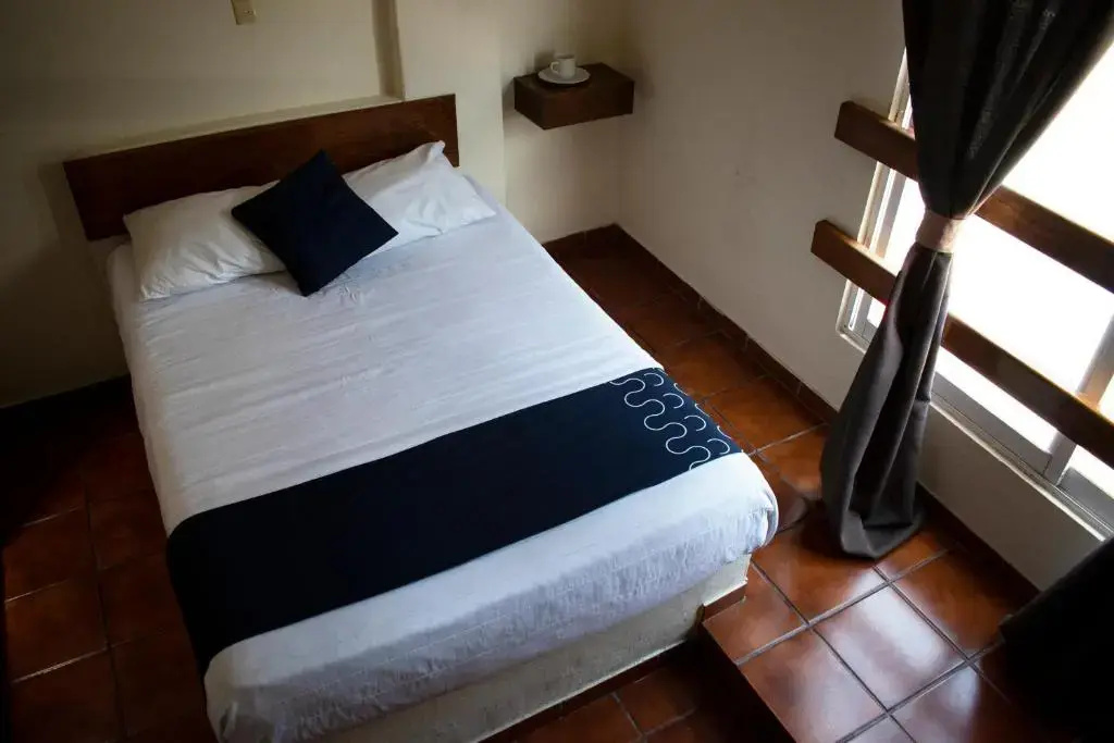 Capital O Hotel Casa Blanca - Chambres