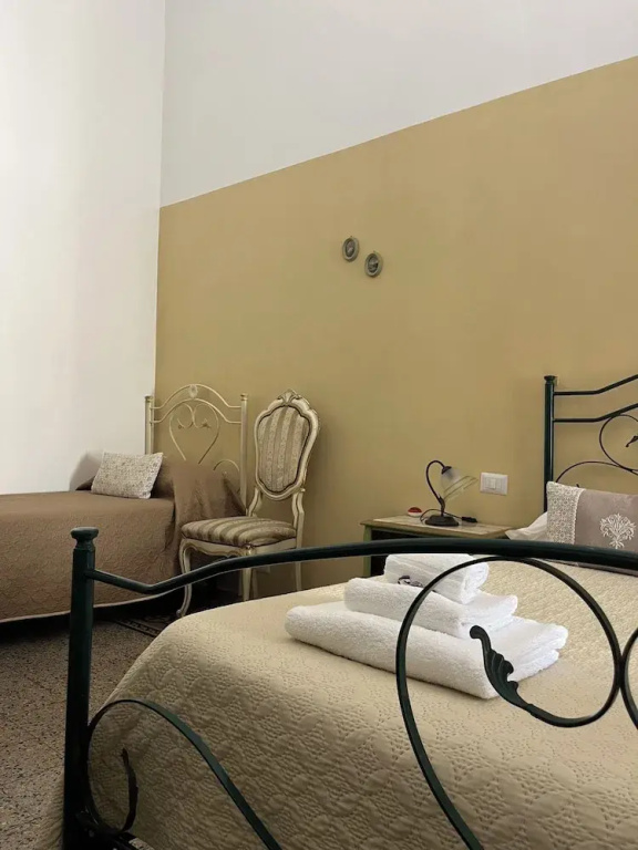 Standard Quadruple Family room with balcony and with courtyard view