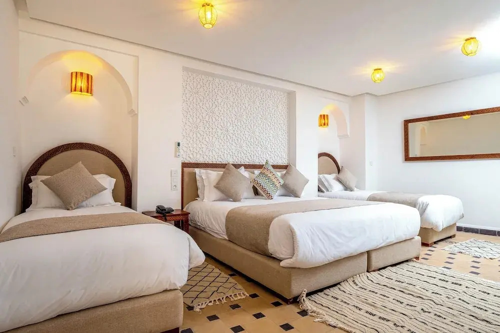 Standard Quadruple Family room with courtyard view
