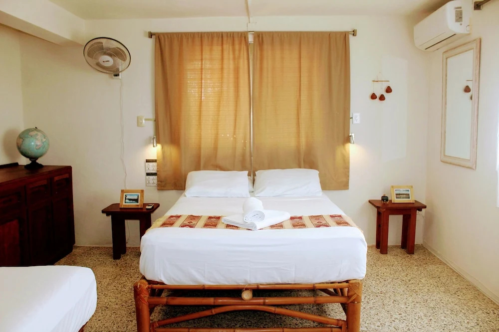 Hostal & Suites Pata de Perro - Chambres