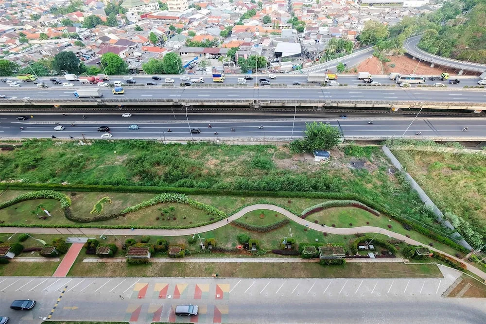 2BR Artistic Room Green Pramuka Apartment closed to Mall By Travelio