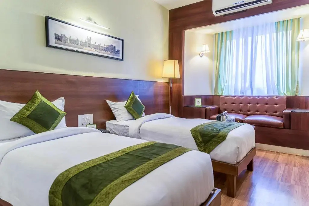 Treebo Premium Grand Emerald - Chambres