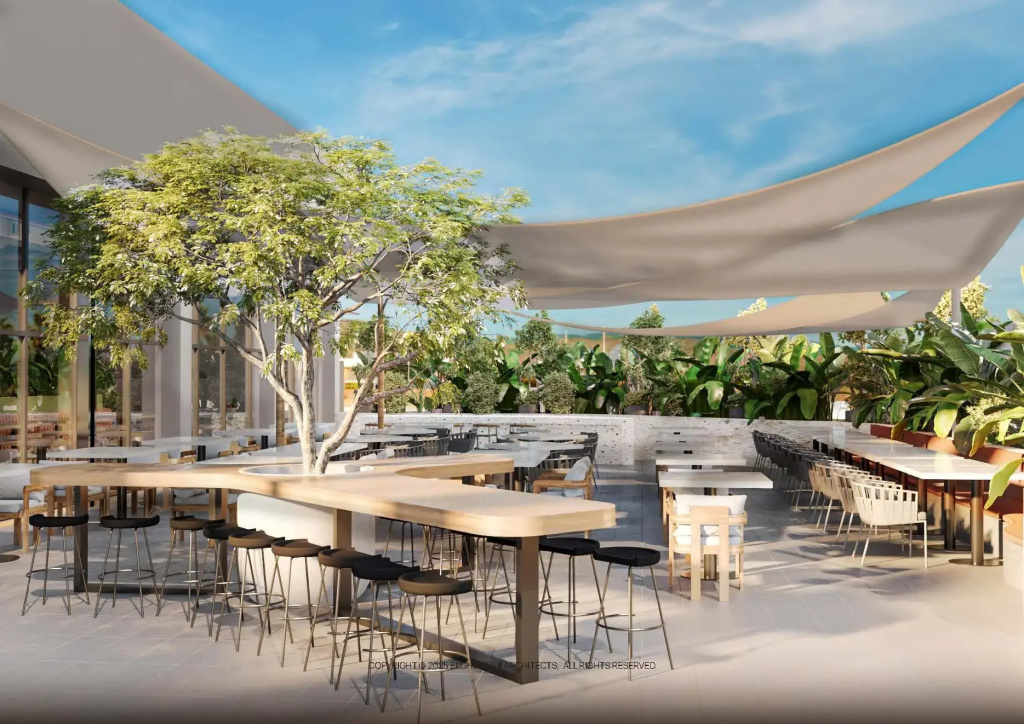 The Kaktus Somabay: An airy, shaded dining area with counter seating, tables, and tropical greenery.