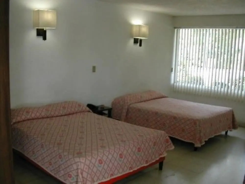 Standard Quadruple room with balcony and with garden view