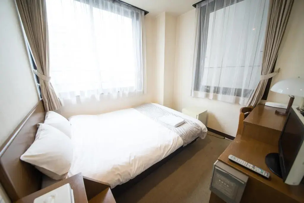 Sai Hotel - Chambres