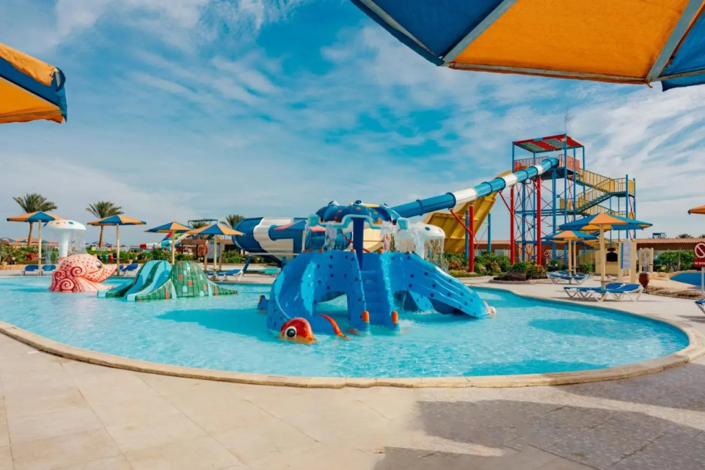 SUNRISE Solara Aqua park Resort: A bright outdoor water park features a pool, colorful waterslides, and splash-play structures.