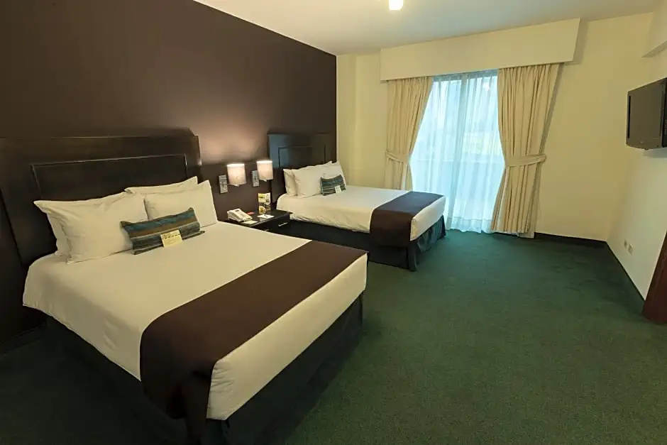 El Polo Hotel & Suites - Chambres
