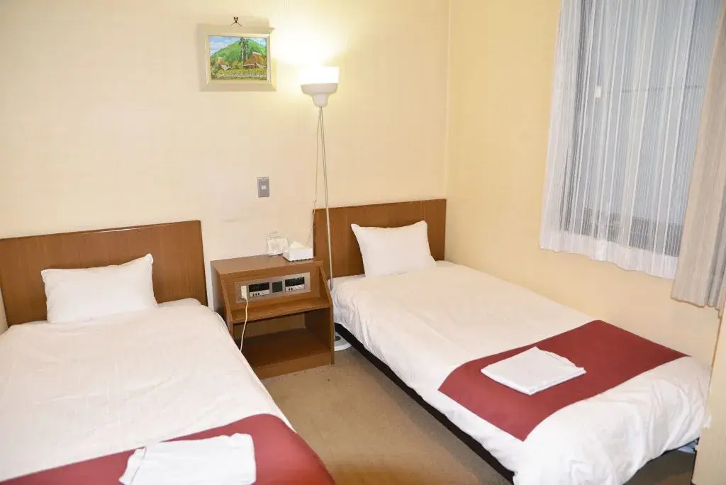 Sai Hotel - Chambres