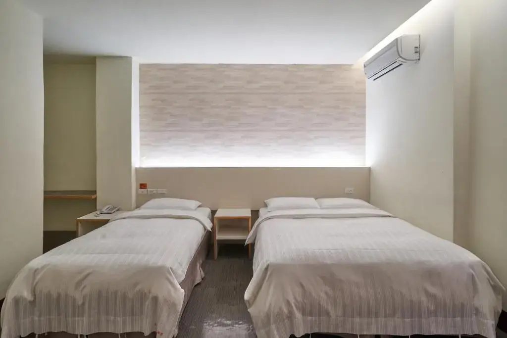 Yung An Business Hotel - Chambres