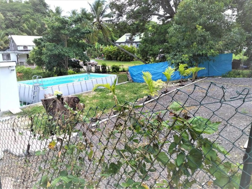 Bungalow d'une chambre avec vue sur la ville piscine partagee et jardin clos a Chateau Gaillard Le Moule a 7 km de la plage
